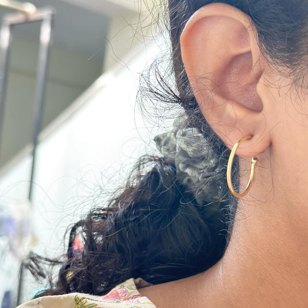 Single hoop style ear studs