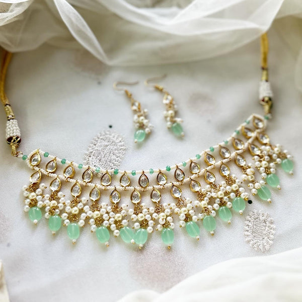 Tear drop polki kundan delicate pastel green beaded choker set