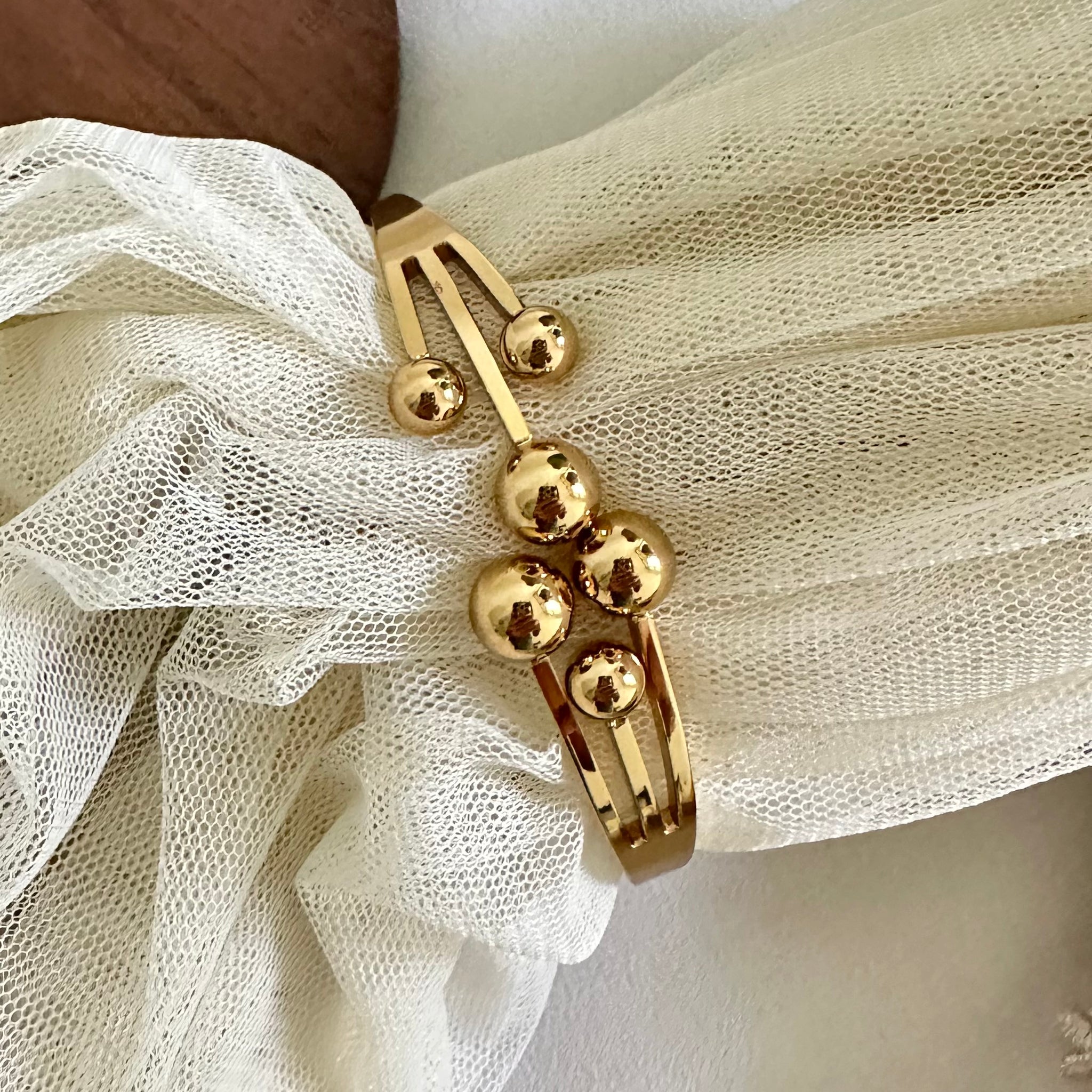 Gold Comets striking bracelet