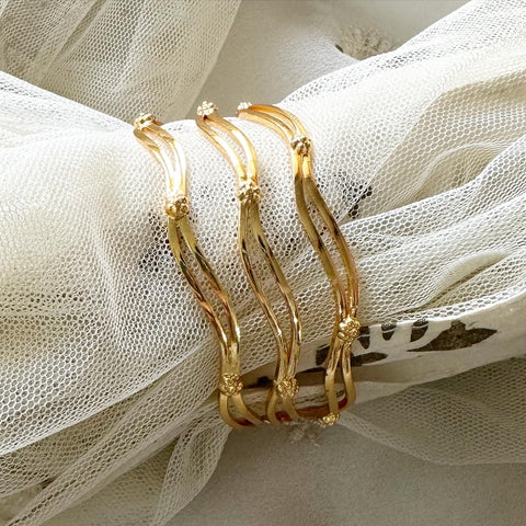 Curvy floral gold bangles - set of 3
