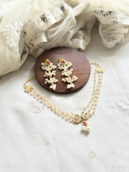 Kundan half moon pearl choker set