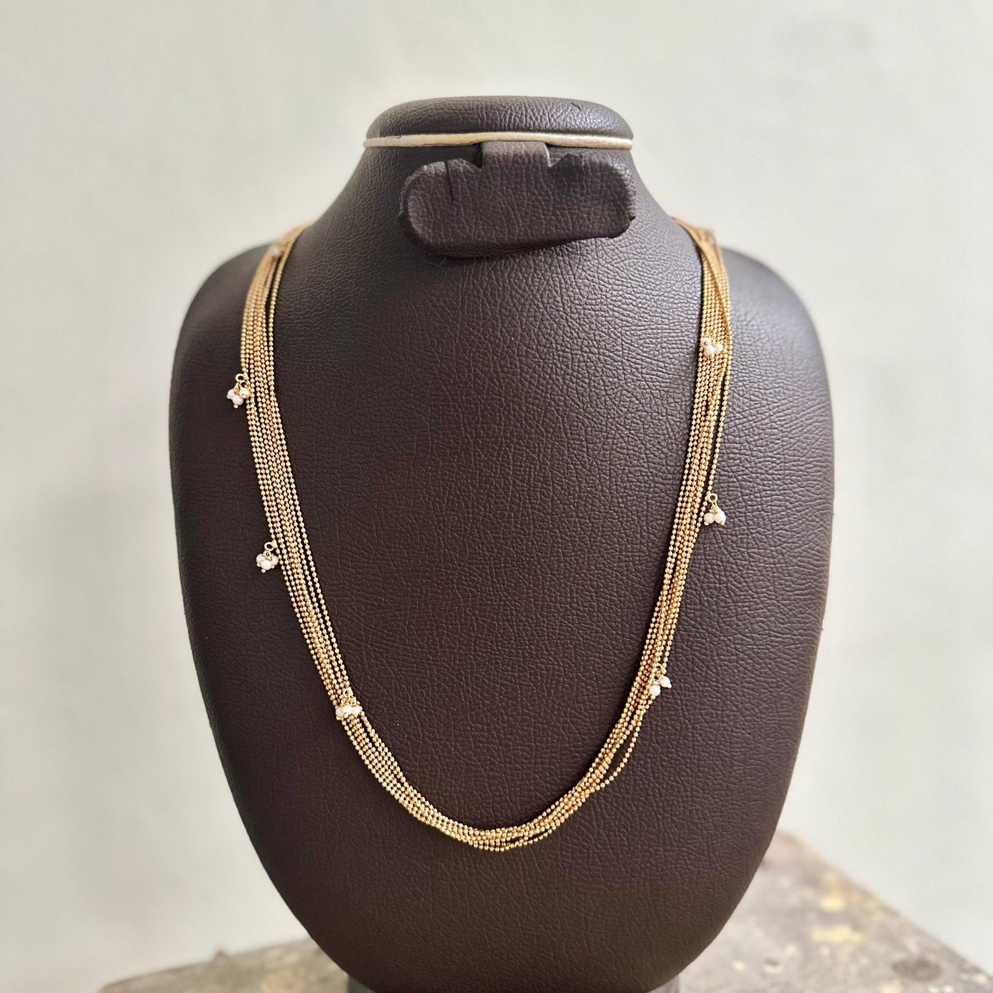 Multi-layer Gold necklace with Pearl bunches